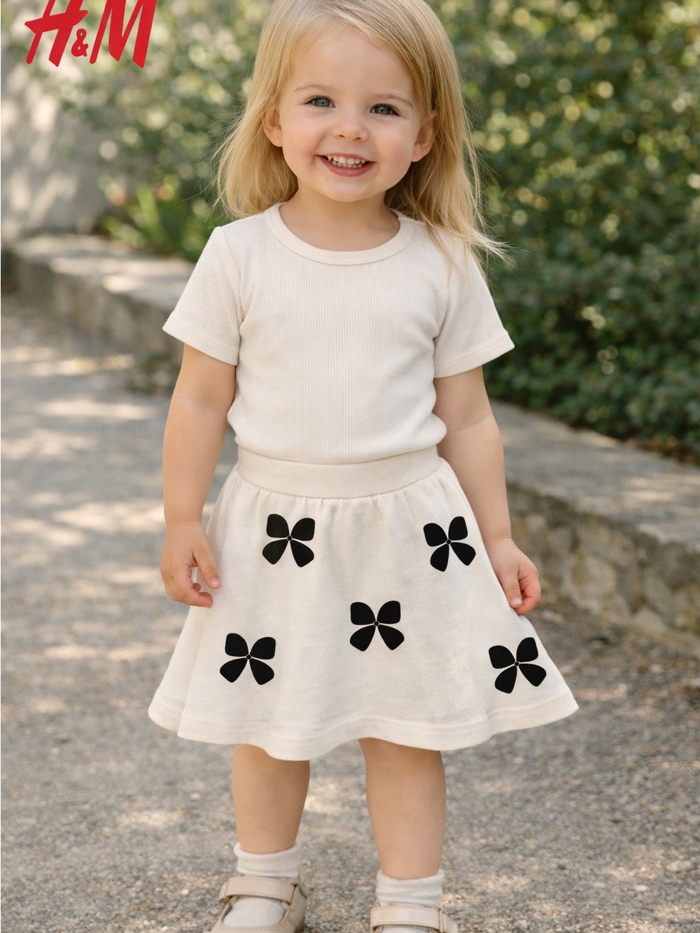 H&M Cream Skirt with Black Bow Appliqués